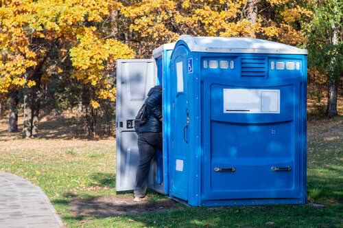 Deluxe flushing porta potty rental unit with sink